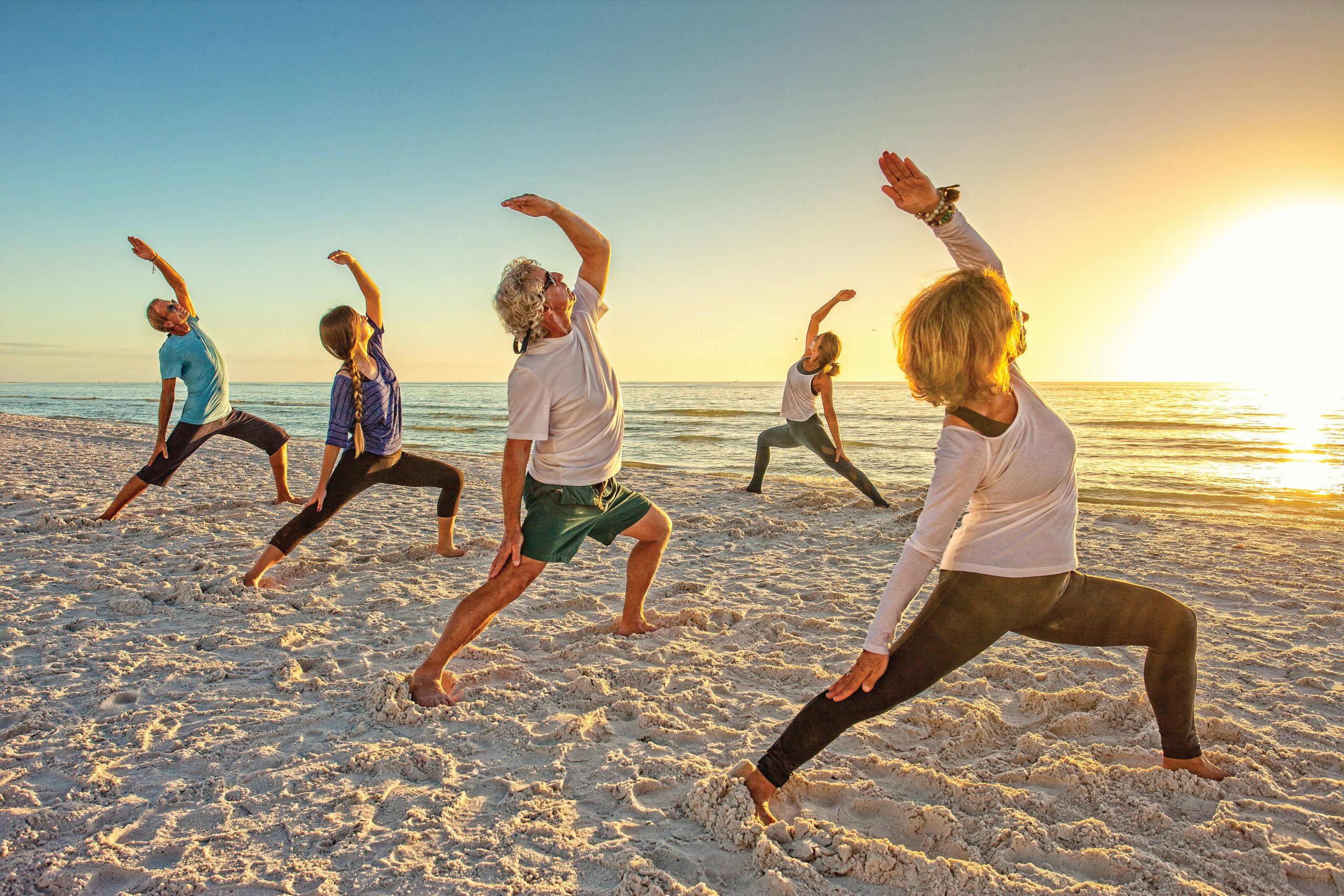 Stretched out on the sand: Find your bliss with beach yoga - Gulfshore  Business