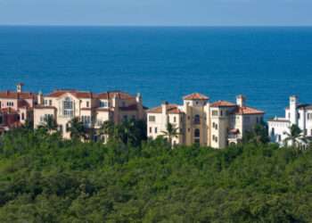 "A cluster of estate homes on the beach in Naples, Florida."