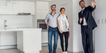 Realtor shows a home to homebuyers.