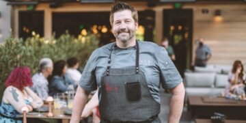 Dustin Valette stands outside The Matheson, his newest restaurant, in Healdburg, California.