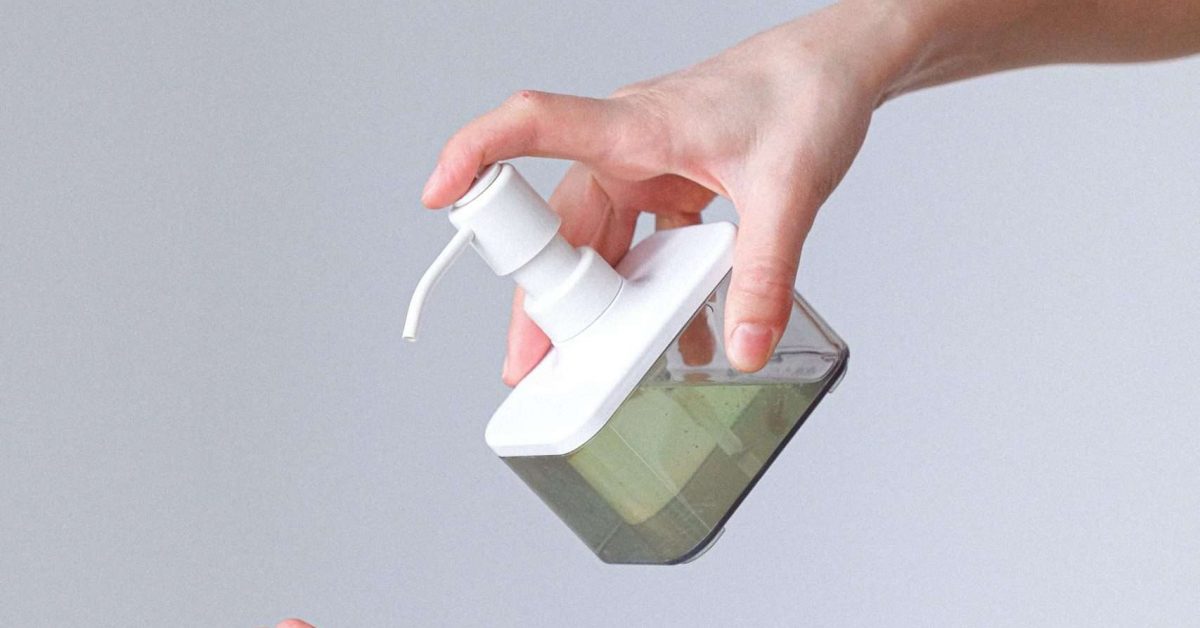 woman-applying-hand-sanitizer-3987142